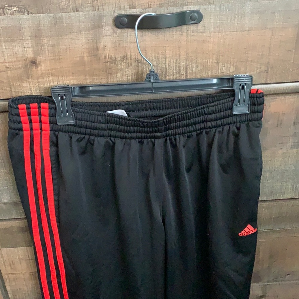 Black and red adidas athletic pants